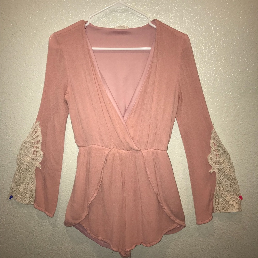 pink romper with laces on arms